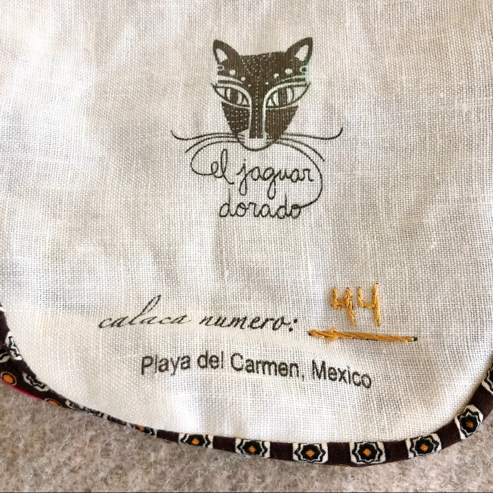 Handmade embroidered Santa Muerte skull wristlet